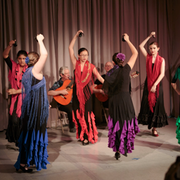 6 teens dancing Sevillanas with castanets, 2015 Recital. Photo: Eric Bandiero.