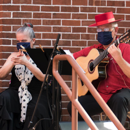 Image: Basilio Georges, guitar, and Aurora Reyes, palmas, both masked, performing at JPAC 8.21.20, photo: Eric Bandiero