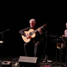 Flushing Town Hall 2017. Basilio Georges, singing and playing guitar with Danny Rivera, baritone sax. Photo: Eric Bandiero.